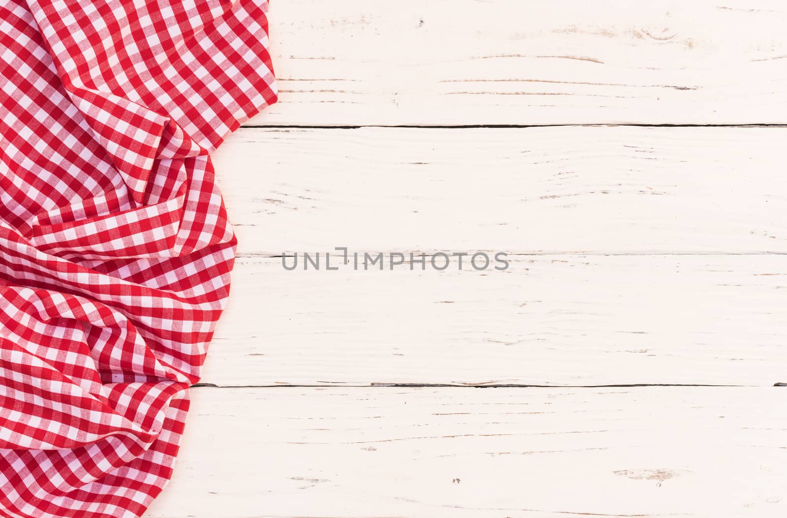 White wooden table background rustic texture, with red checkered tablecloth, high angel view