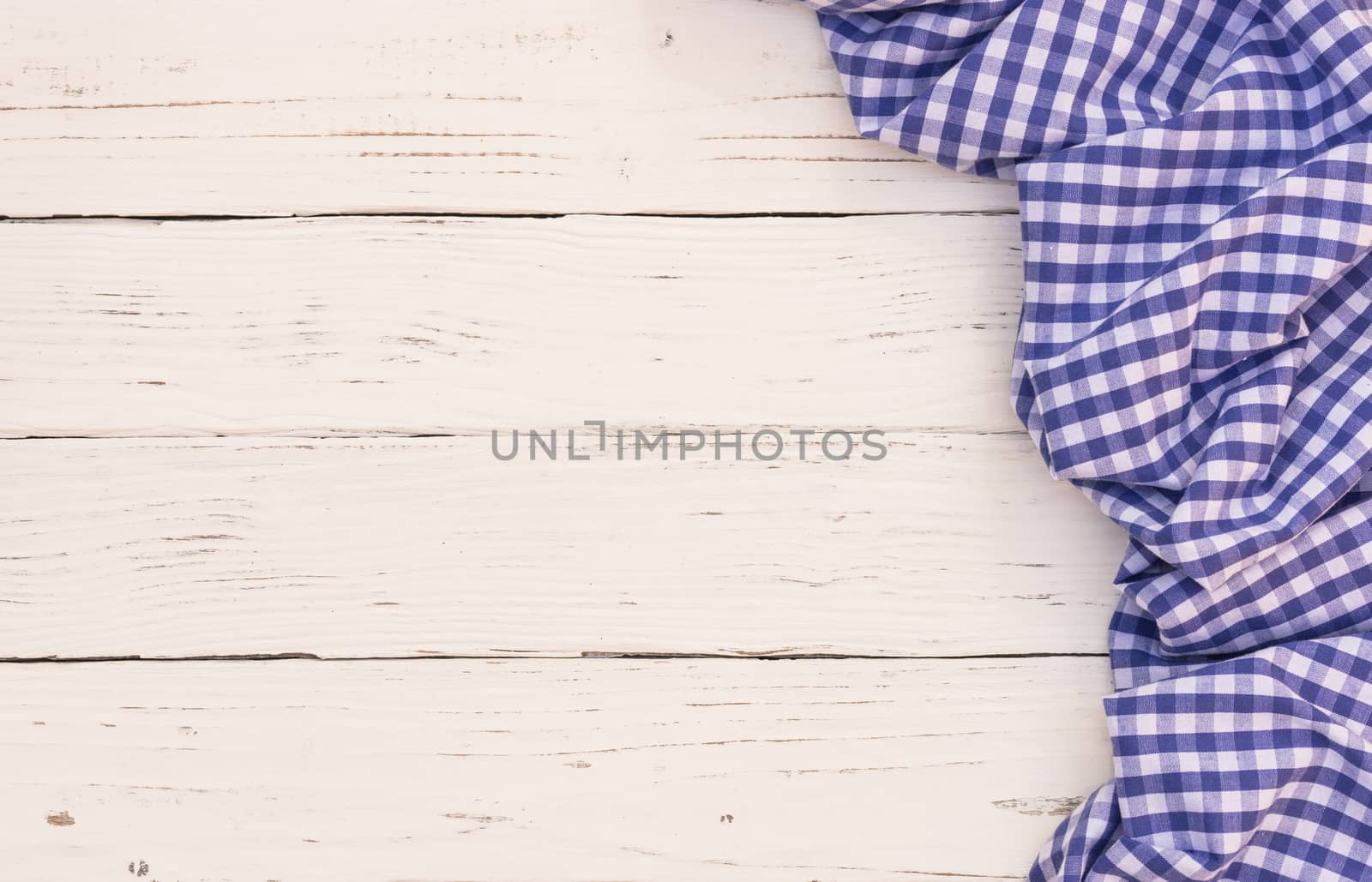 White wooden table background rustic texture, with blue checkered tablecloth, high angel view