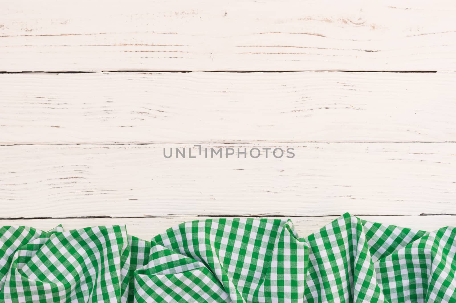 White wooden table background rustic texture, with green checkered tablecloth, high angel view