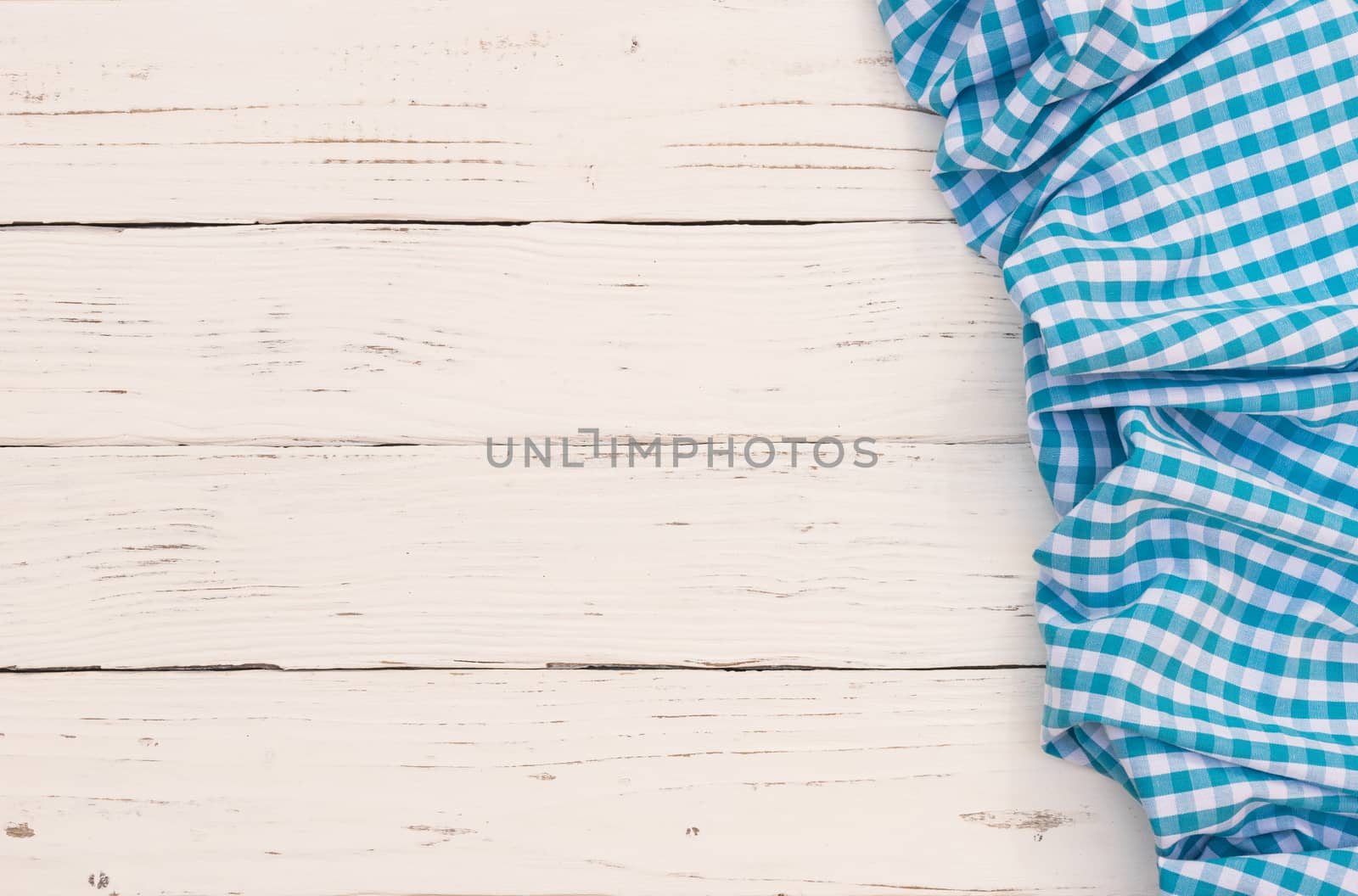 White wooden table background rustic texture, with blue checkered tablecloth, high angel view