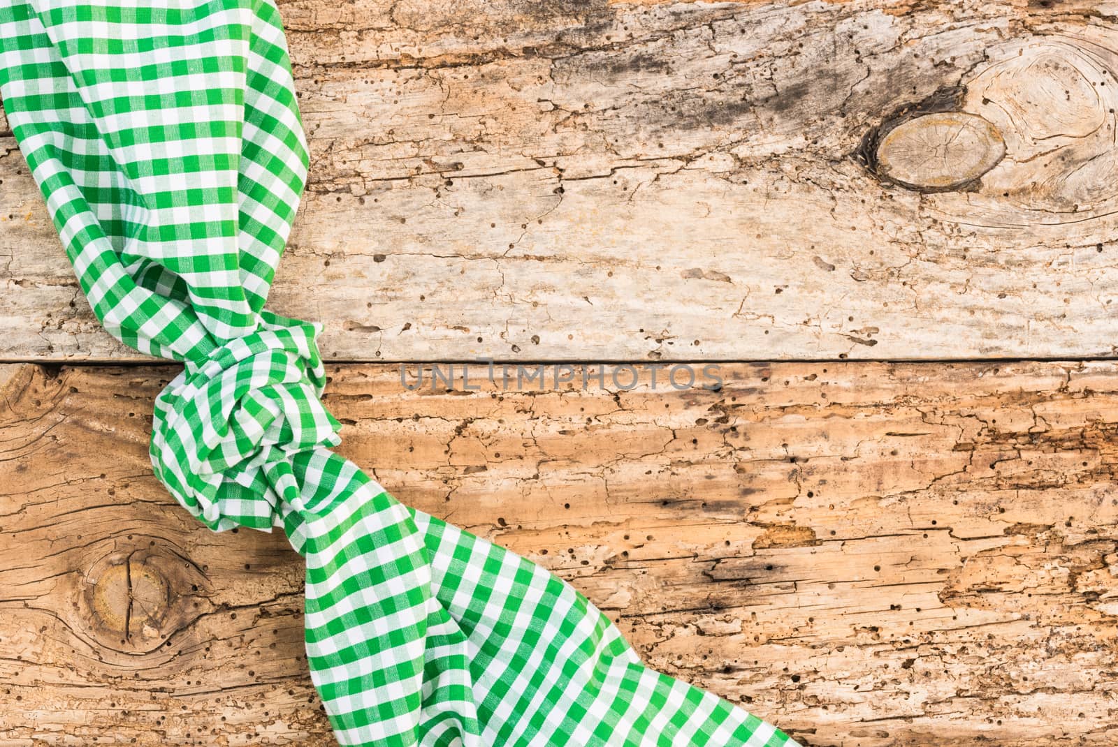 Wooden table background rustic texture, with green checkered tablecloth, high angel view