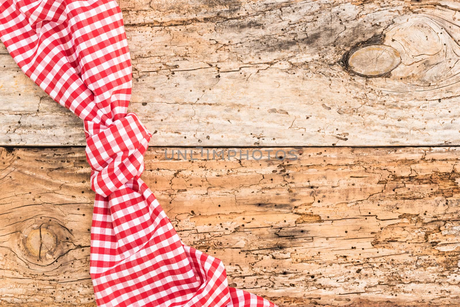 Wooden table background rustic texture, with red checkered tablecloth, high angel view

