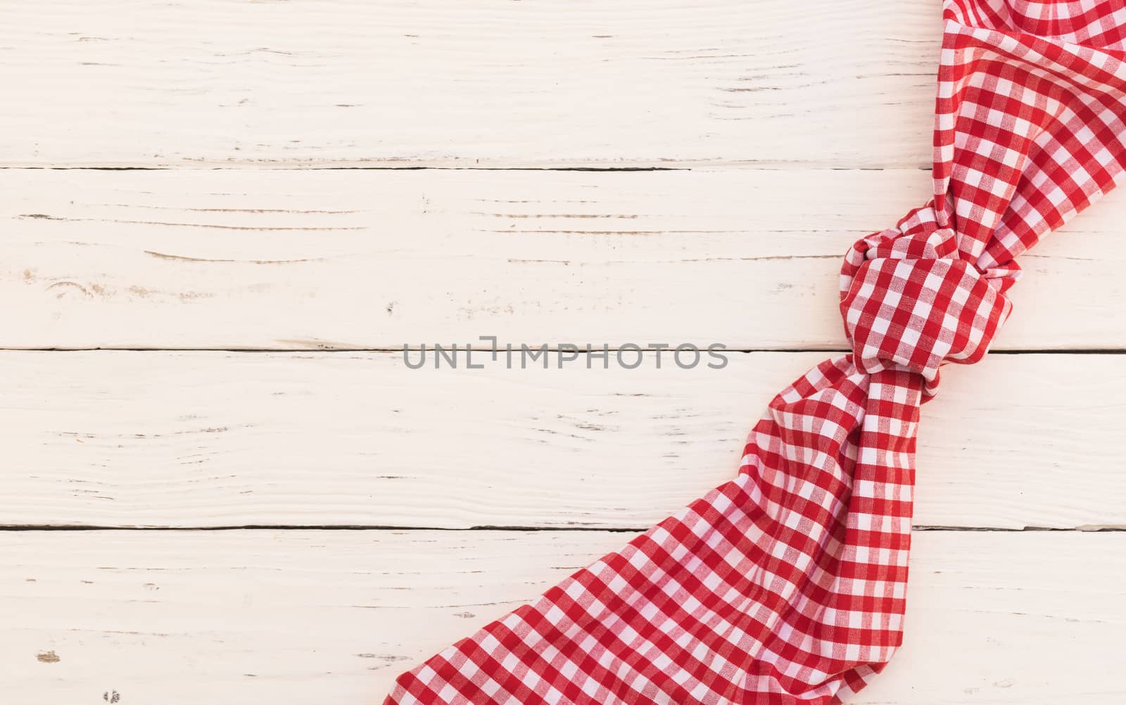 White wooden table background rustic texture, with red checkered tablecloth, high angel view