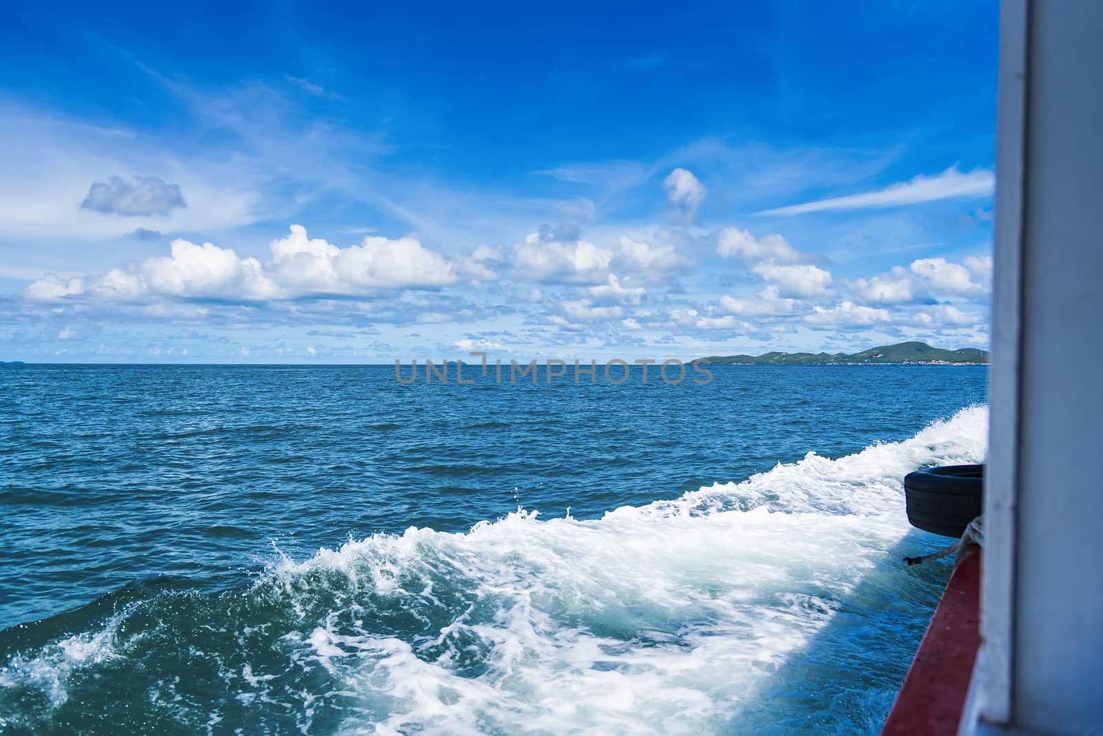 Water blue ocean splash and boat in the sea way ,Waves splashing on the side of ship