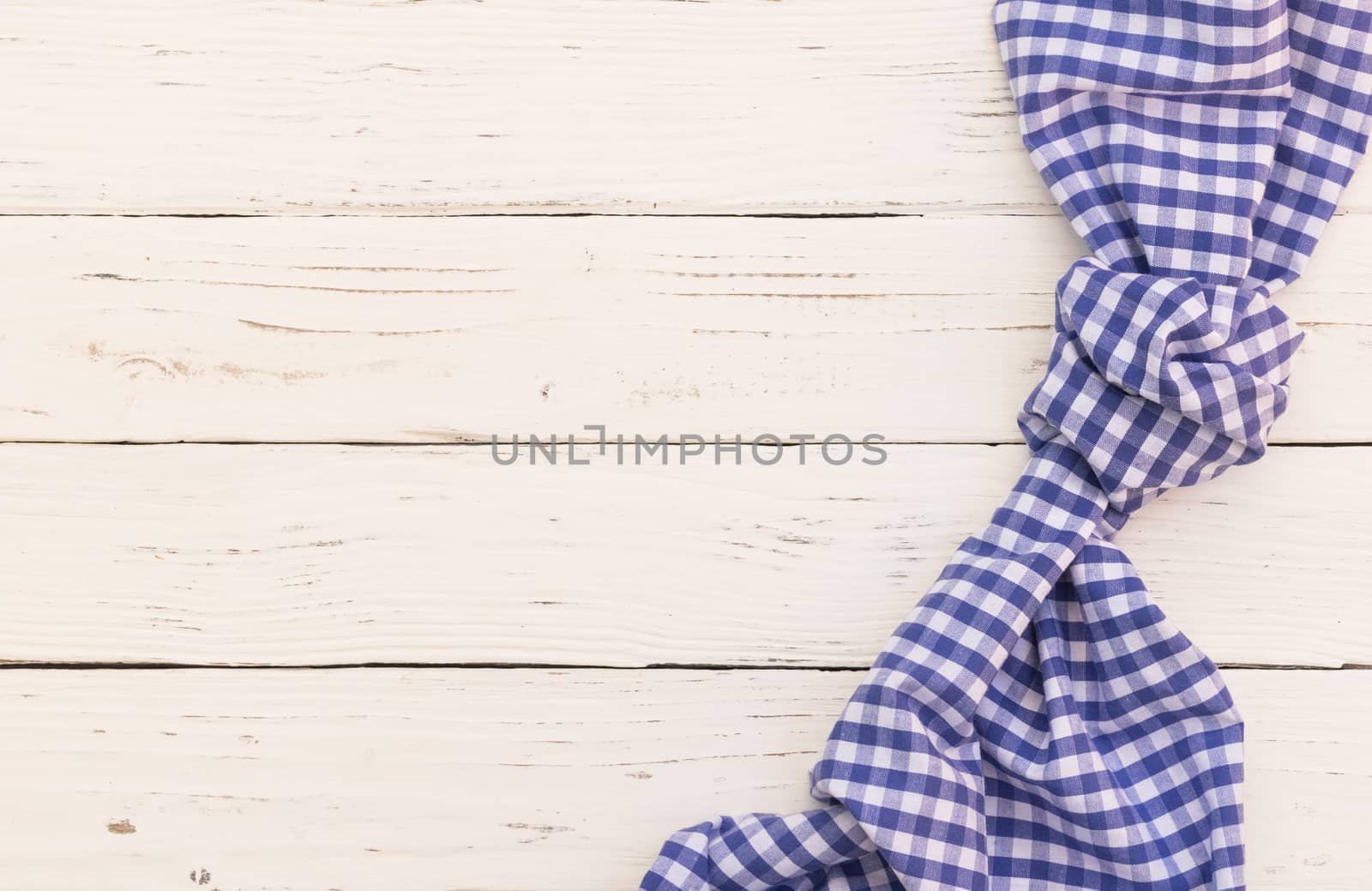 

White wooden table background rustic texture, with blue checkered tablecloth, high angel view