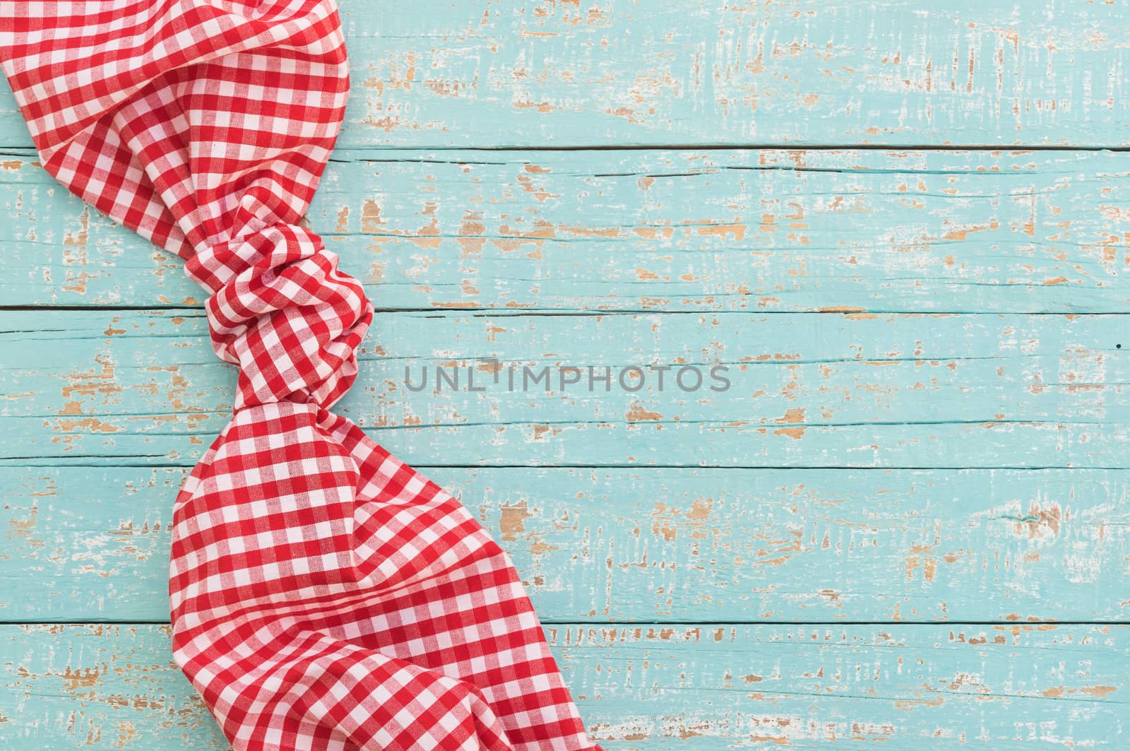 Blue wooden table background rustic texture, with red checkered tablecloth, high angel view