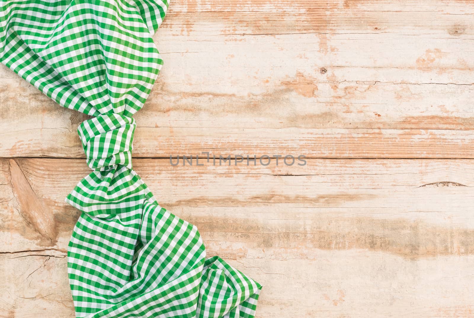 Wooden table background rustic texture, with green checkered tablecloth, high angel view