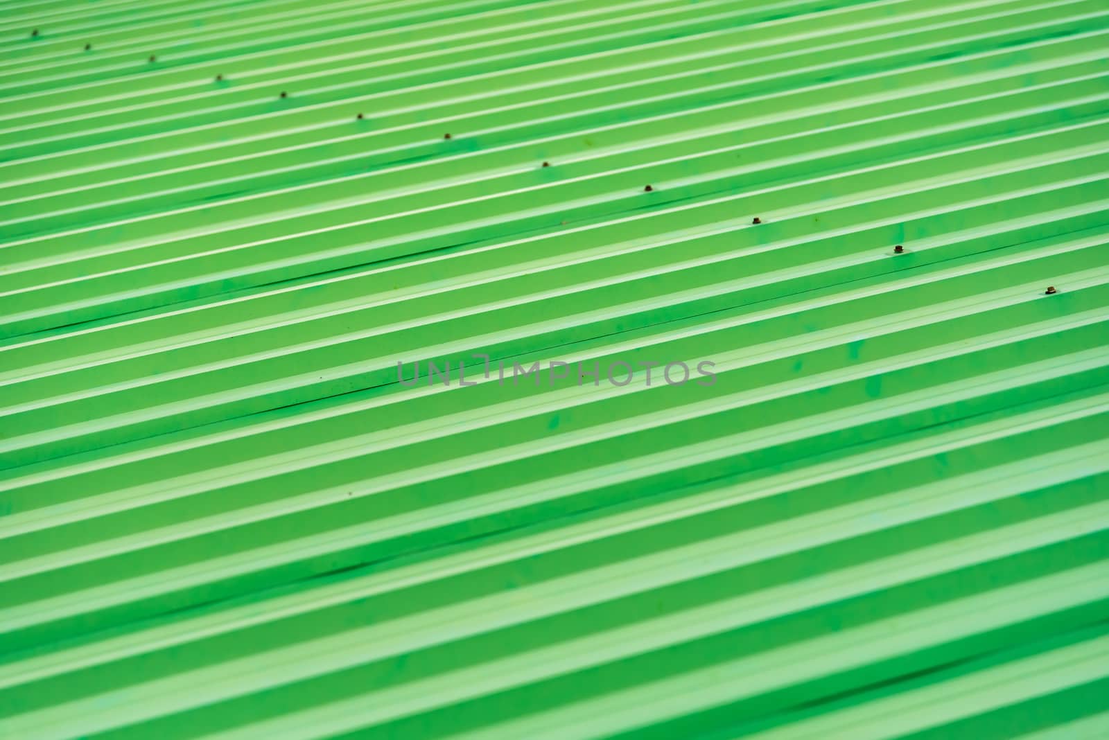 Green painted metal roof as an abstract background by Bubbers
