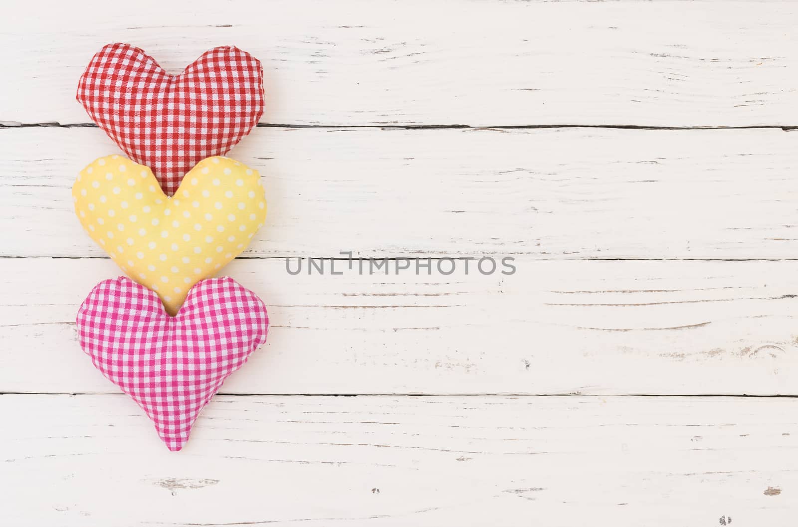 Valentines day, romantic hearts on white wooden background with copy space