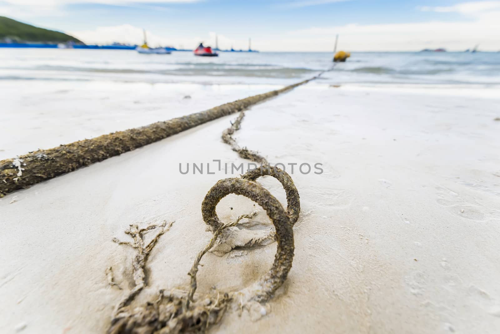 Broken marine rope and sea in background