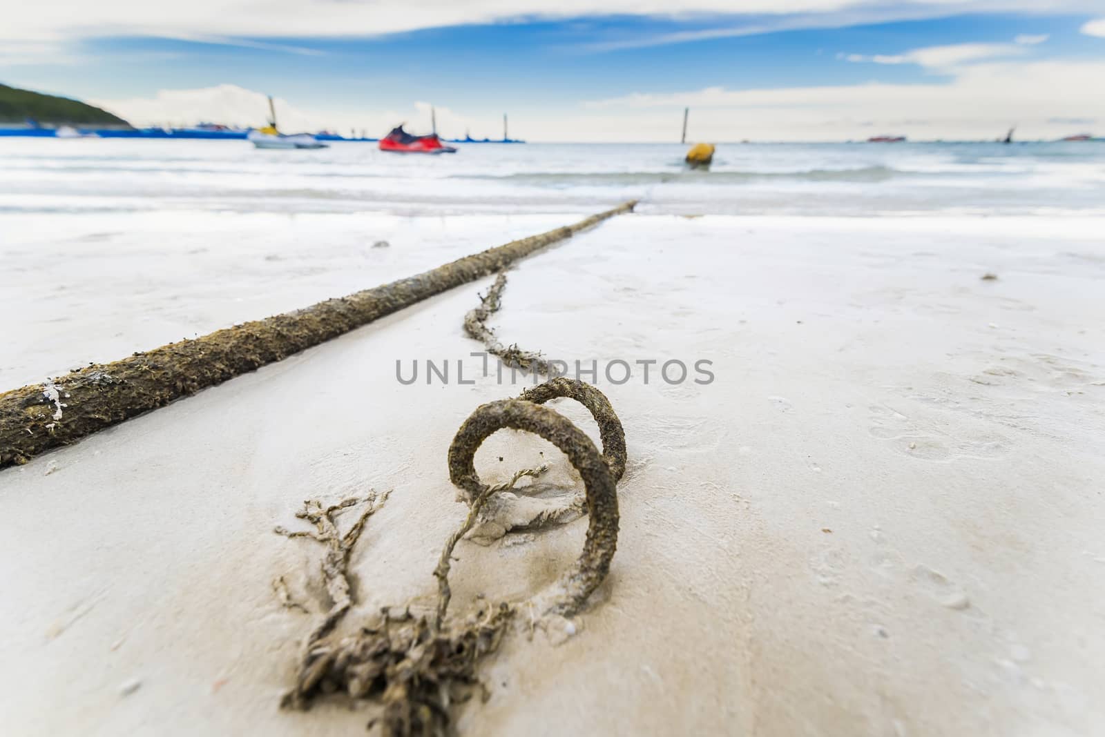 Broken marine rope and sea in background