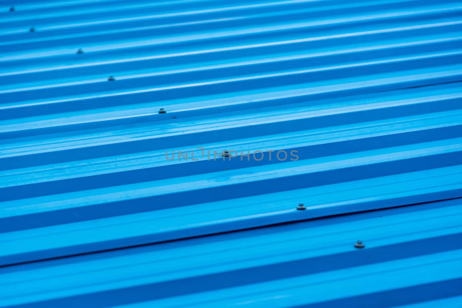 Blue painted metal roof as an abstract background by Bubbers