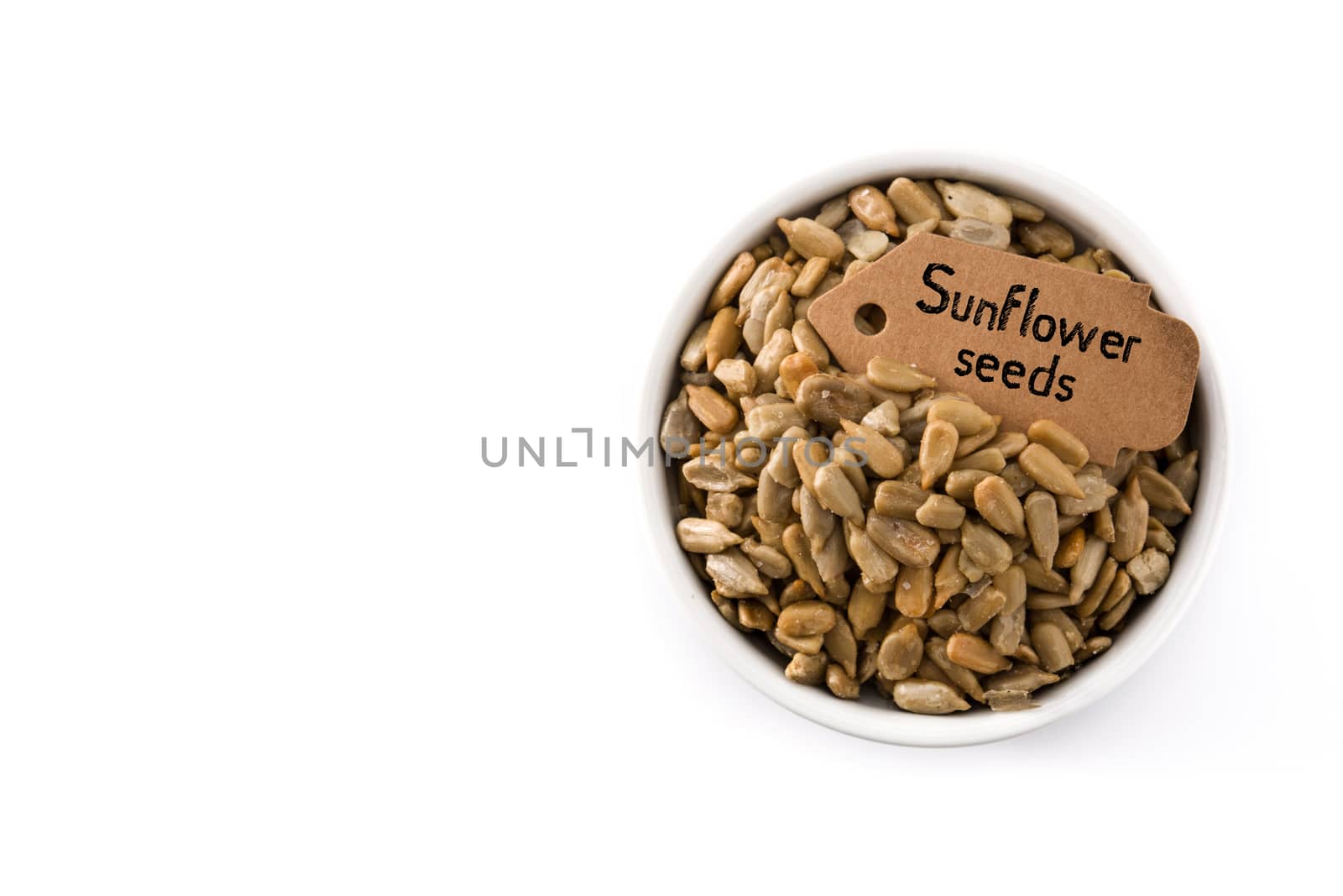 Sunflower seeds in bowl isolated on white background
