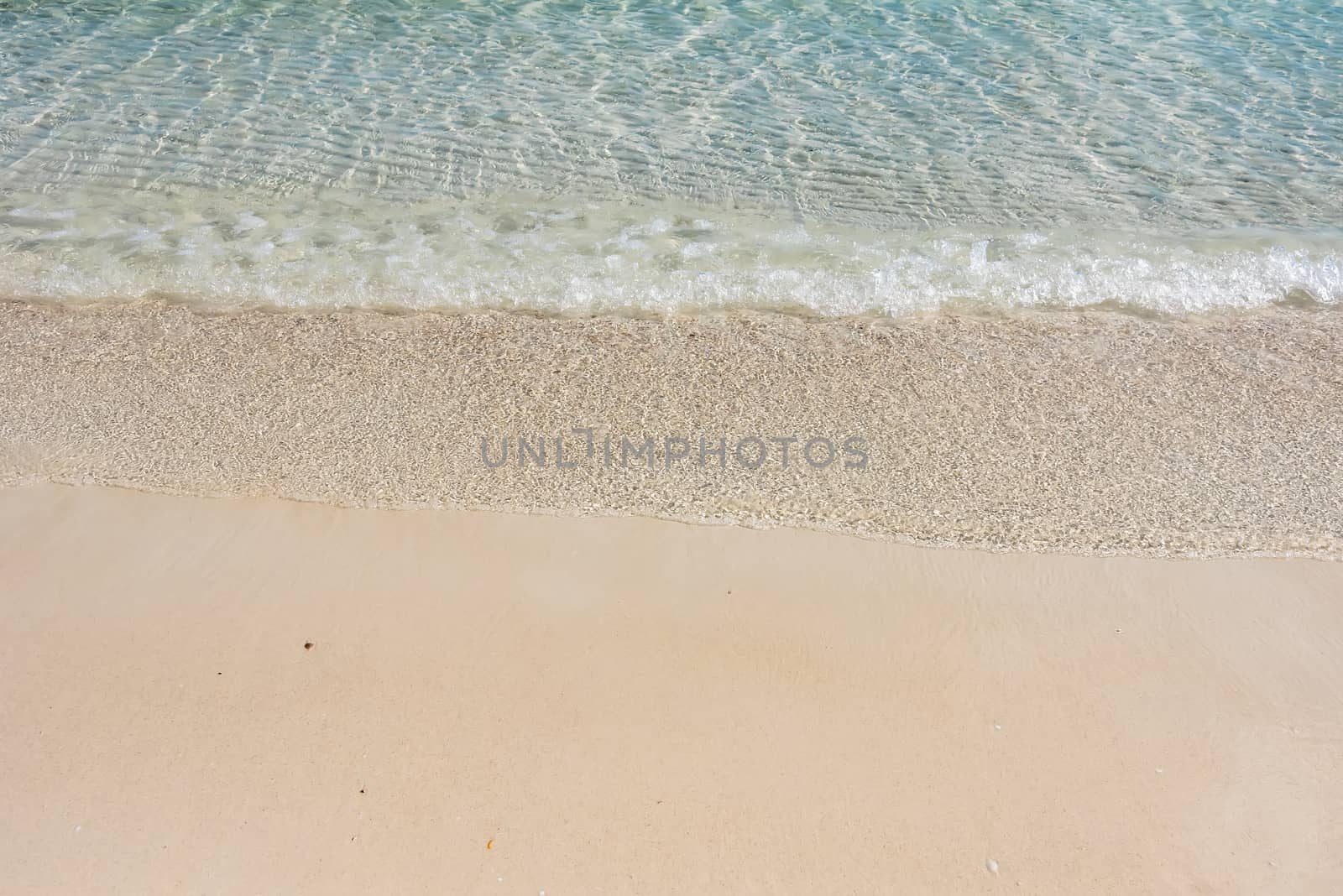 Beach and sea background, Sand and bubble, wave. Soft wave on sandy beach. Background.
