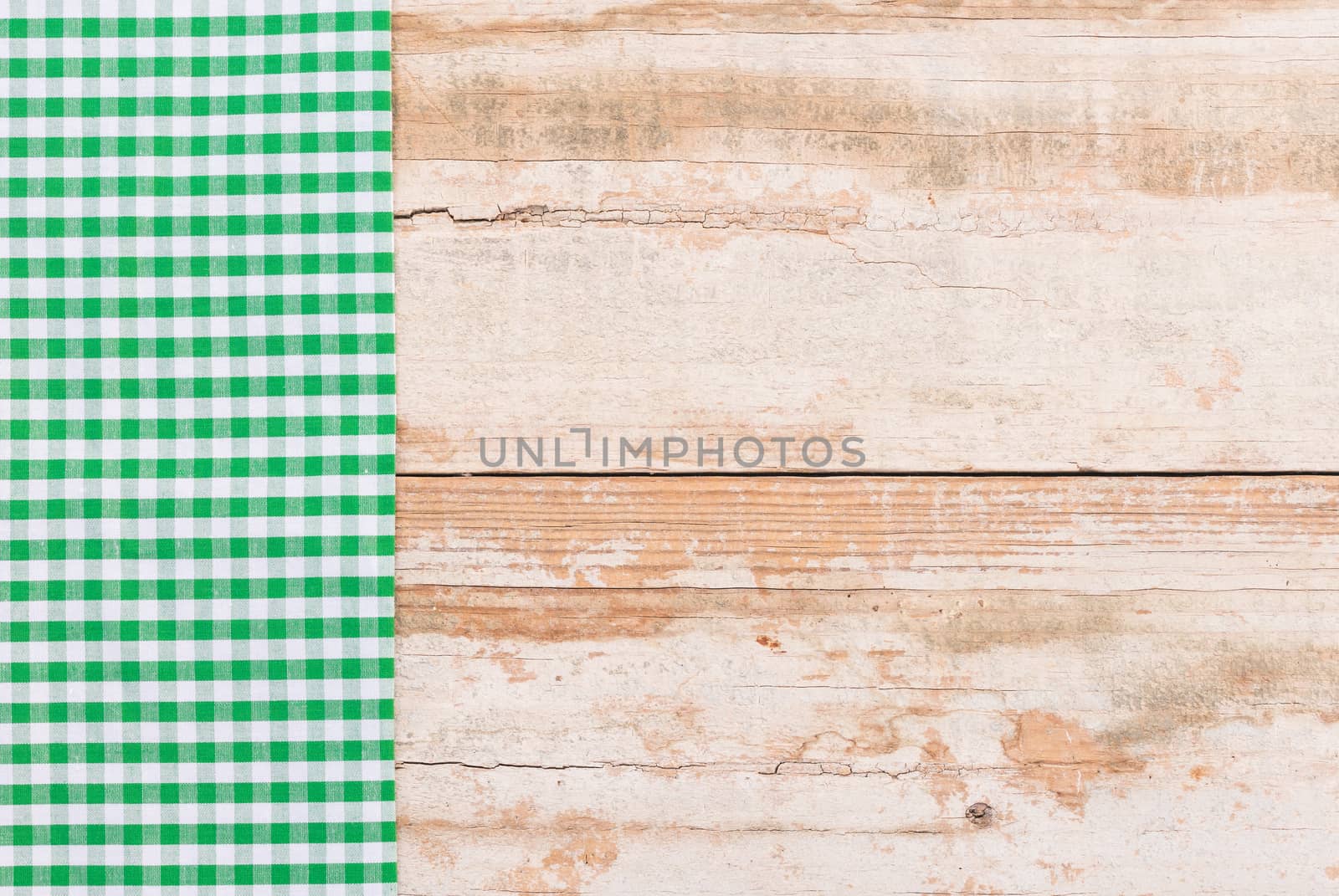 Wooden table background rustic texture, with green checkered tablecloth, high angel view

