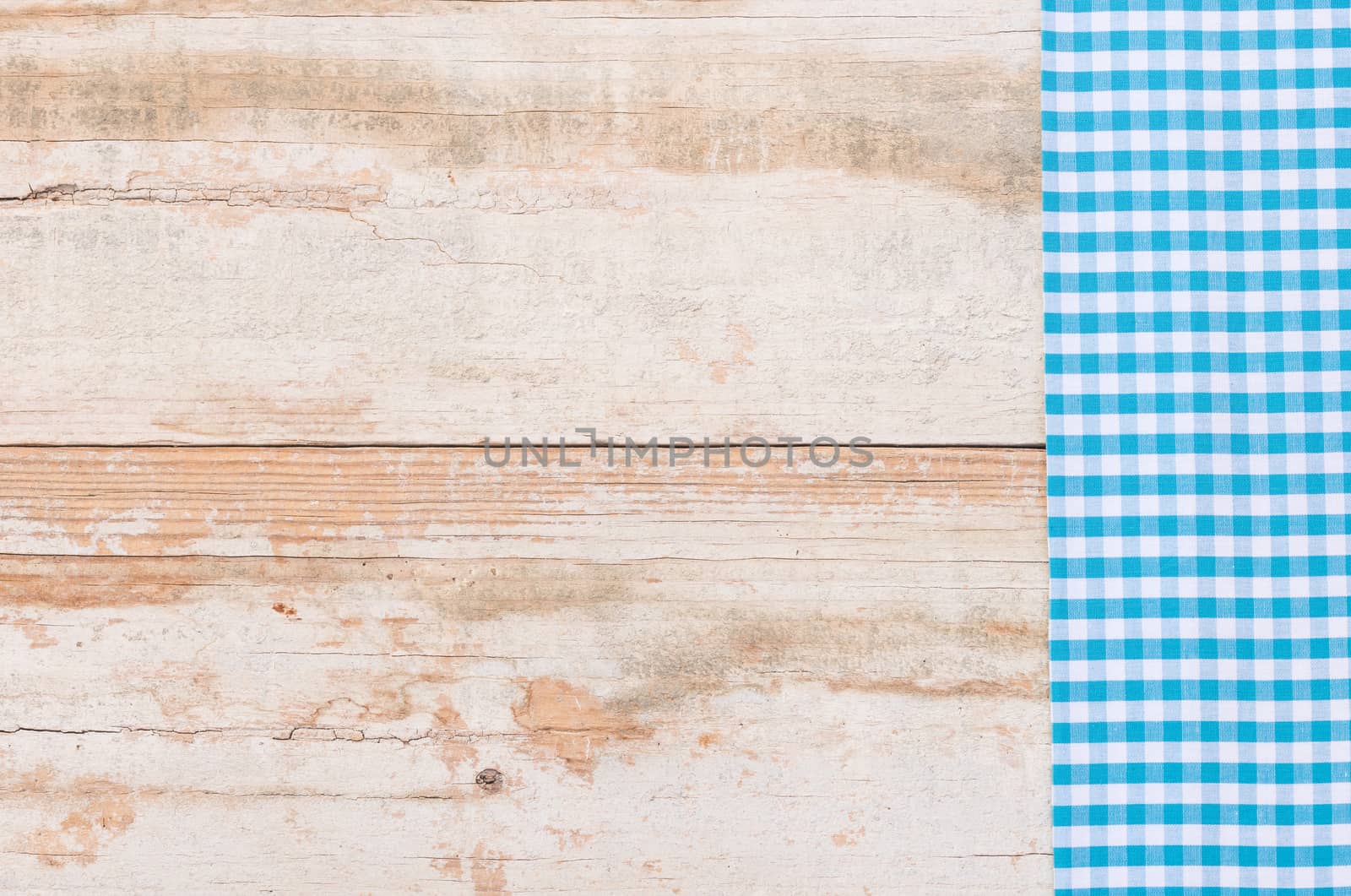 Wooden table background rustic texture, with blue checkered tablecloth, high angel view