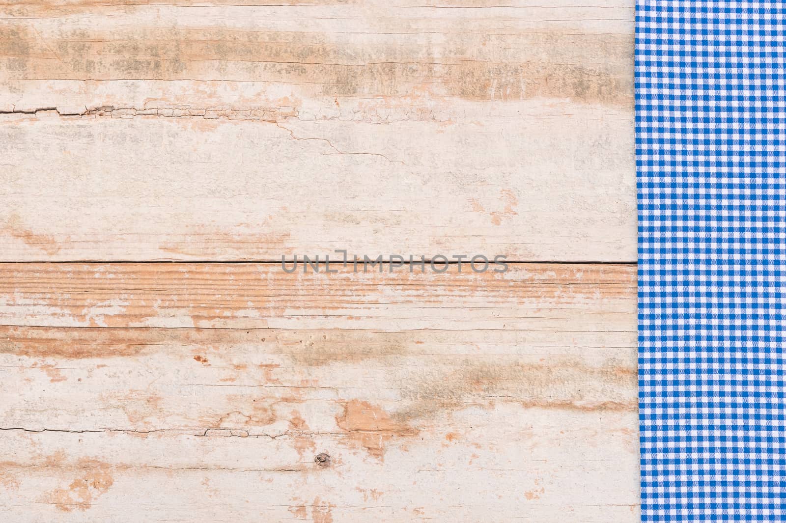 Wooden table background rustic texture, with blue checkered tablecloth, high angel view