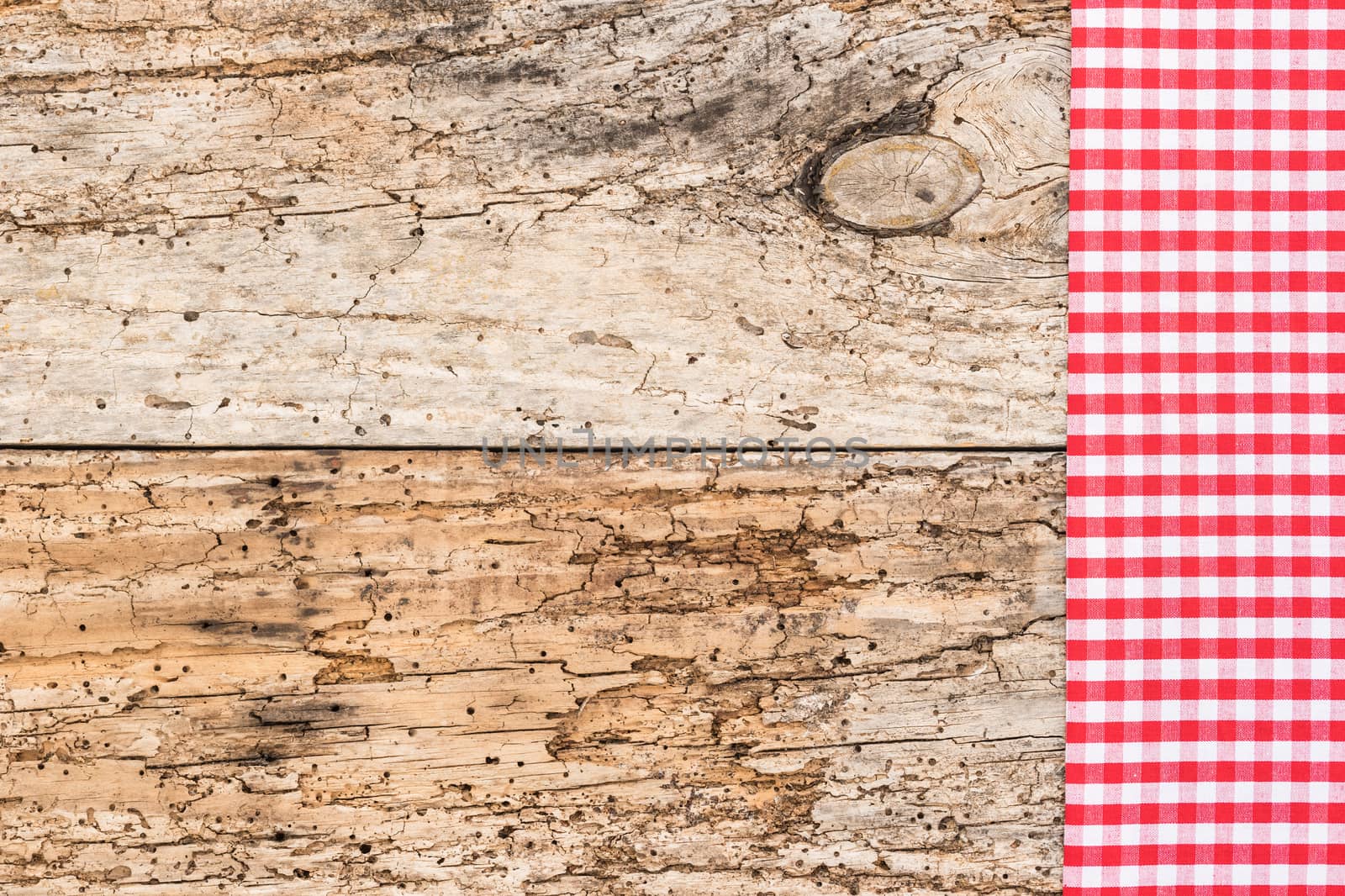 Wooden table background rustic texture, with red checkered tablecloth, high angel view