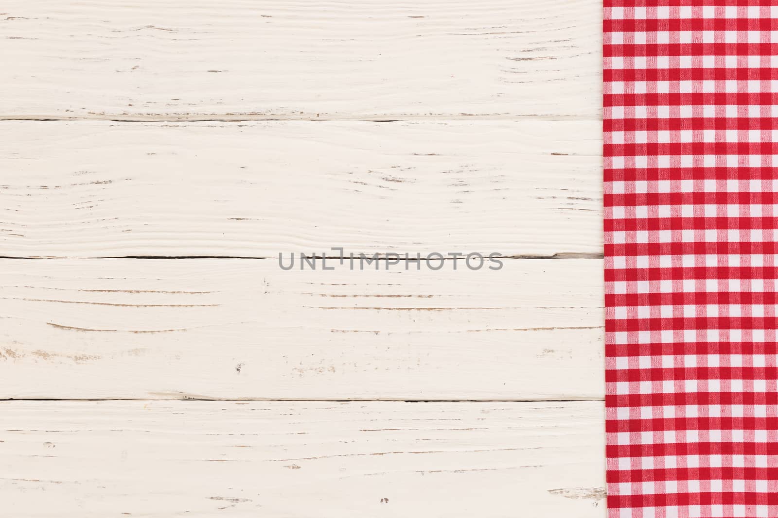 White table background with rustic red tablecloth