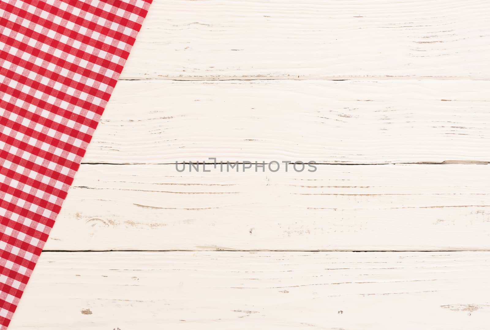 White table background with rustic red tablecloth, high angle view