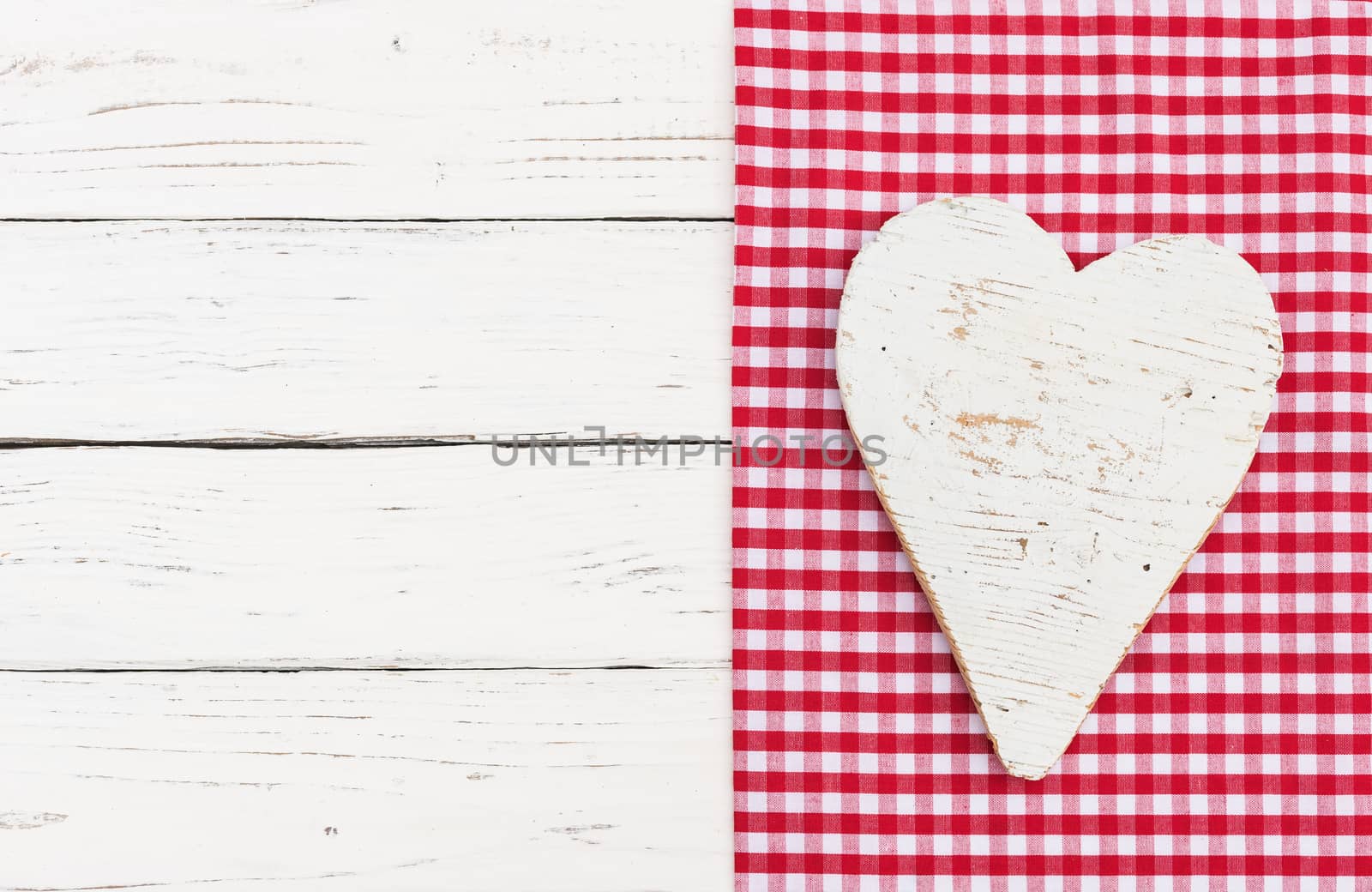 Romantic white heart on wooden background for Valentine card with copy space
