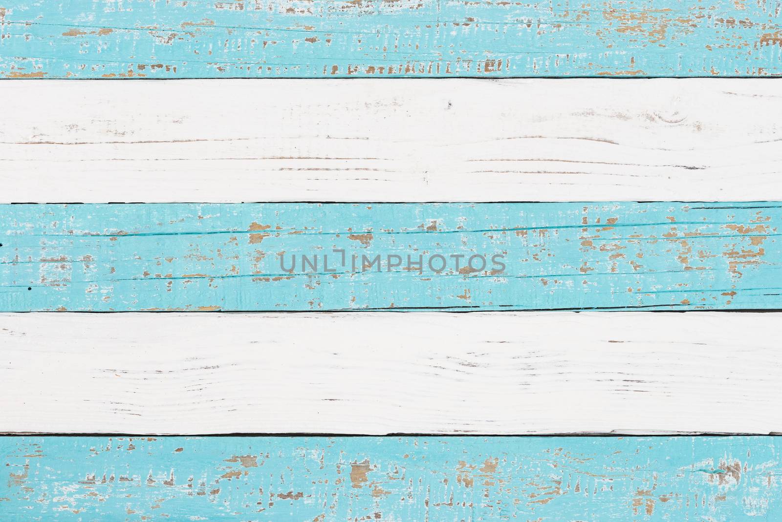 Wooden background texture of white and light blue colored planks