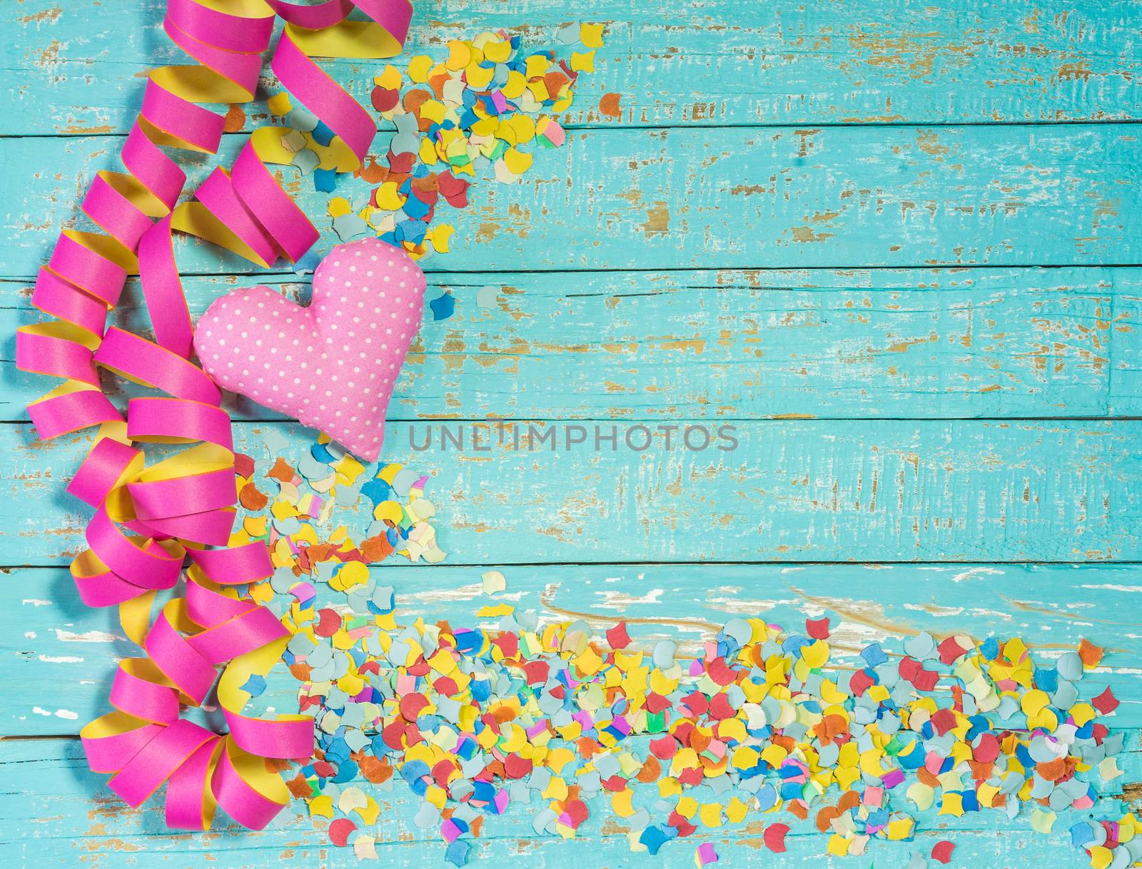 Colorful party, birthday or carnival celebration background with heart, streamers and confettis