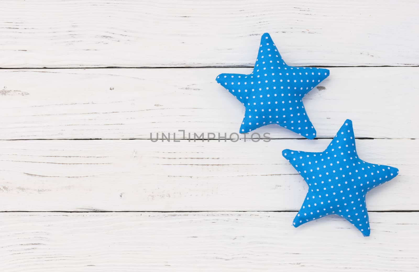 Blue stars decoration on white wood with copy space