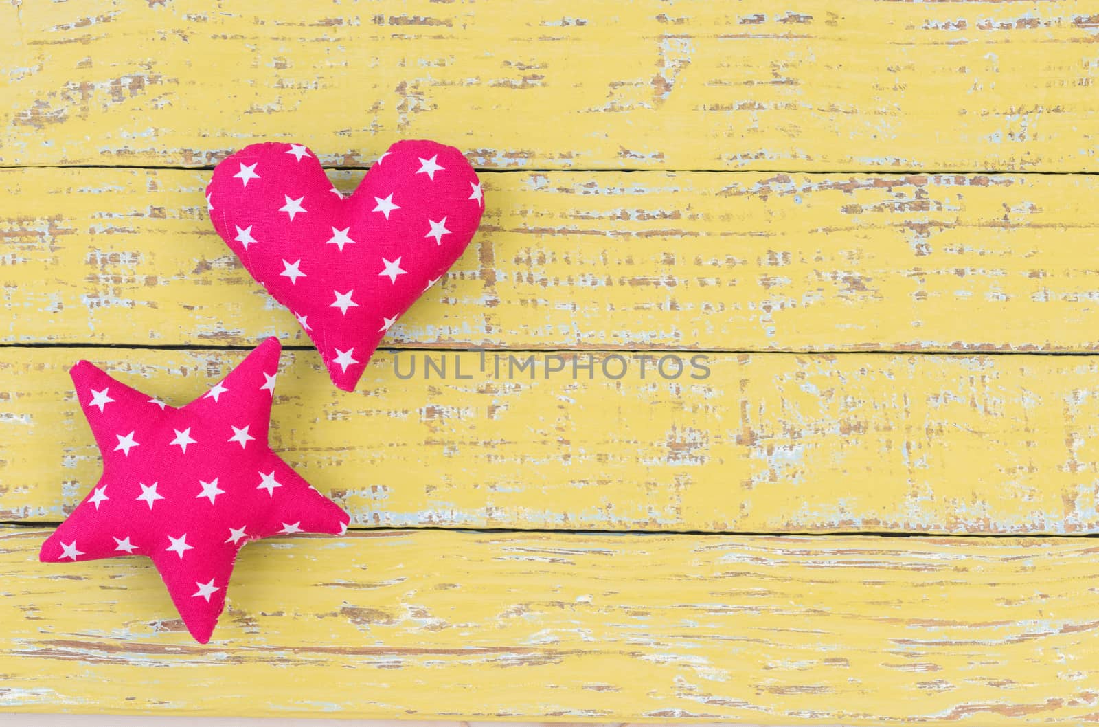 Star and heart decoration on vintage wooden background with copy space