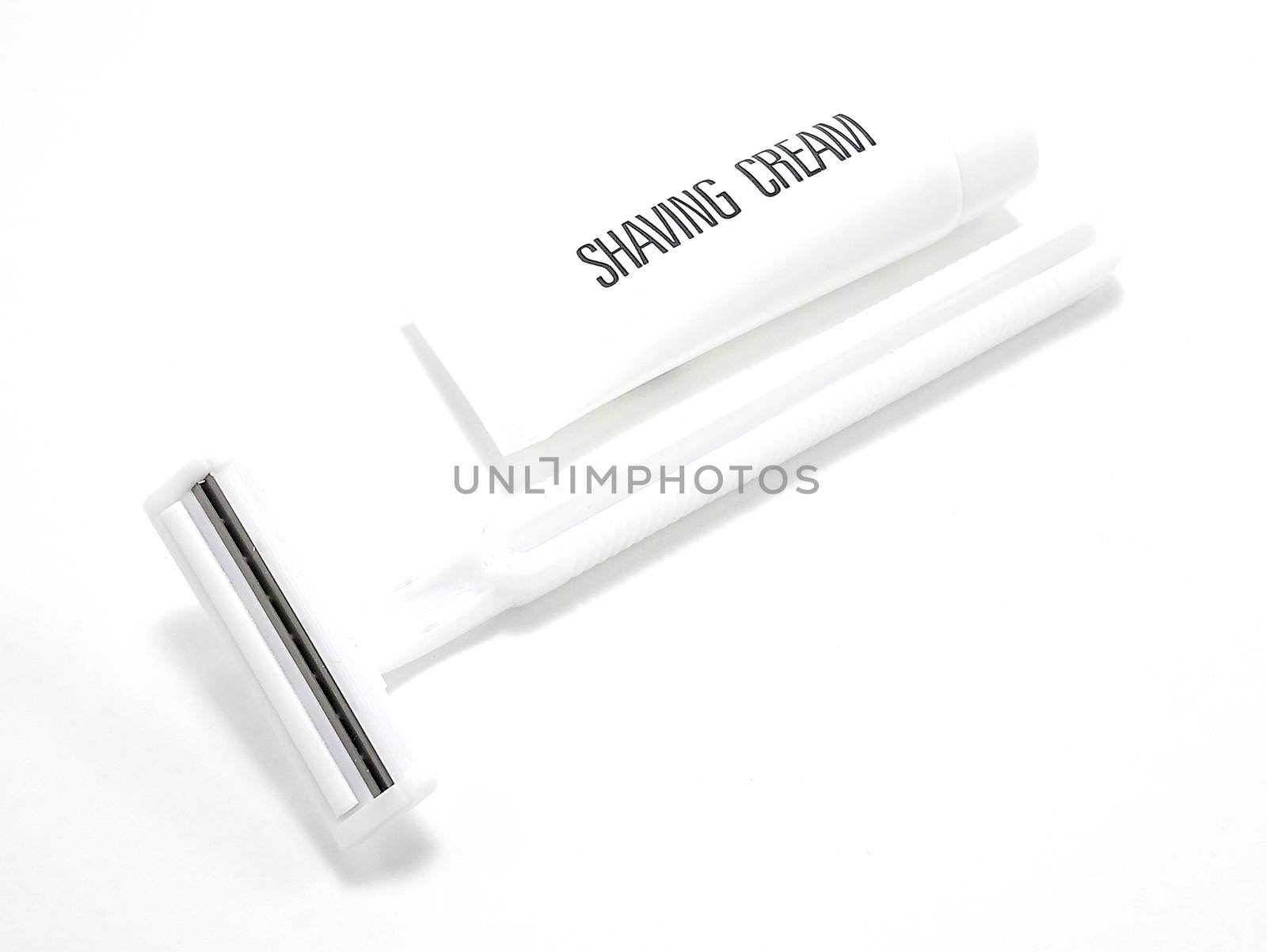 Disposable white plastic body manual shaver with blade attach to the head and shaving cream