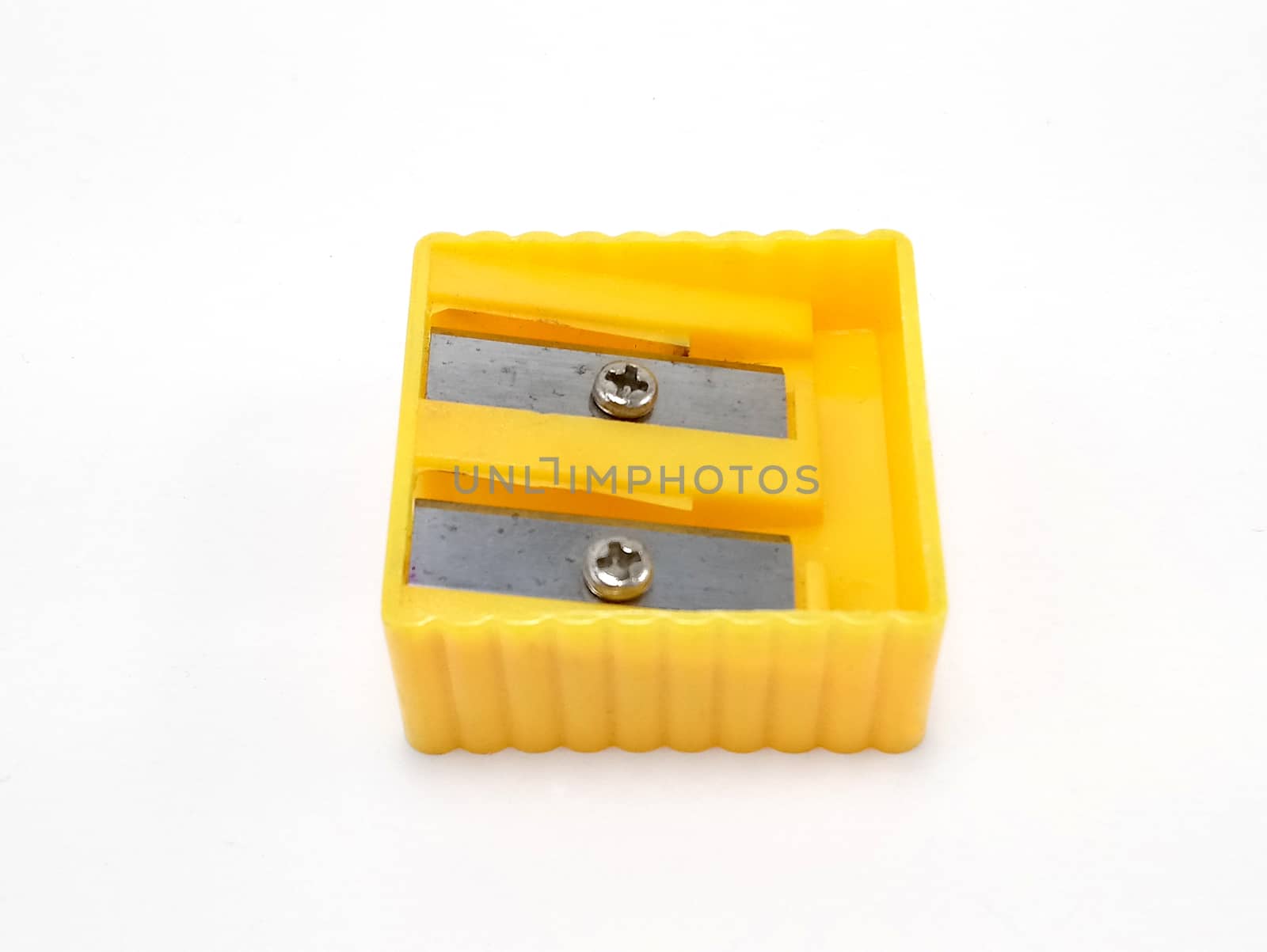 Two slot yellow pencil sharpener use to sharpen the tip point of pencil