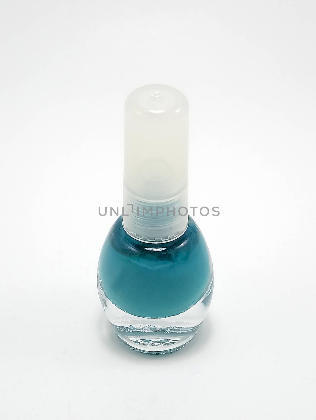 Turquoise nail polish with brush inside in the bottle by imwaltersy