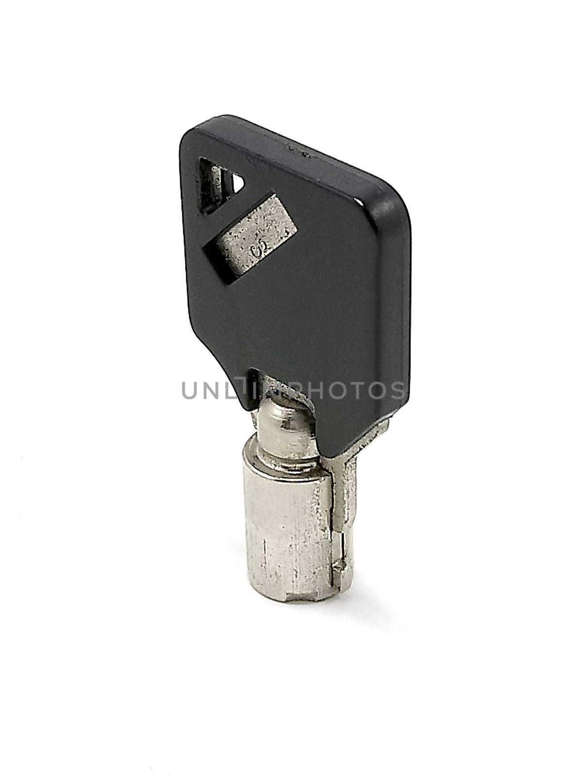 small black tubular key use to lock and unlock keyhole