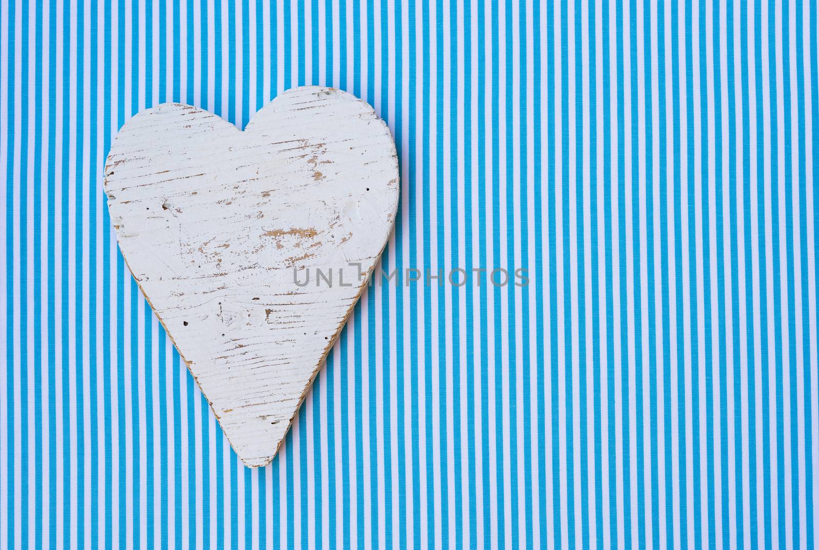 Baby boy birthday greeting card with blue background heart and copy space