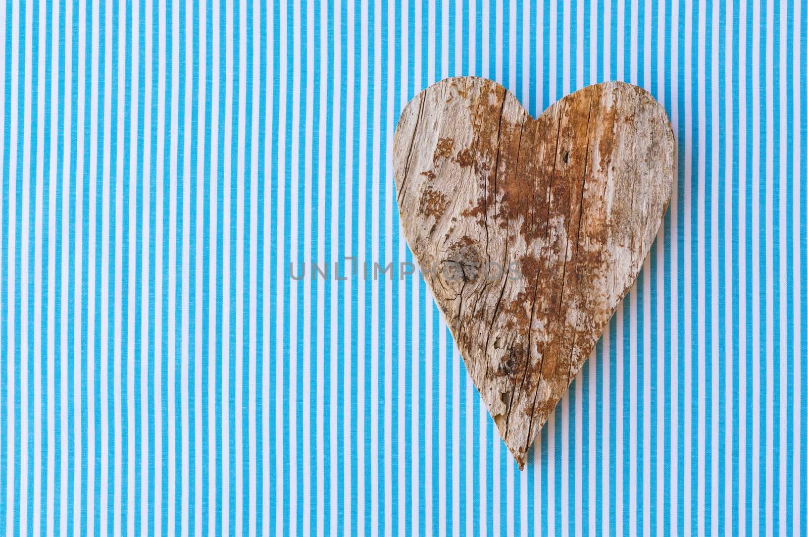 Fathers day background with handmade rustic wooden heart and copy space