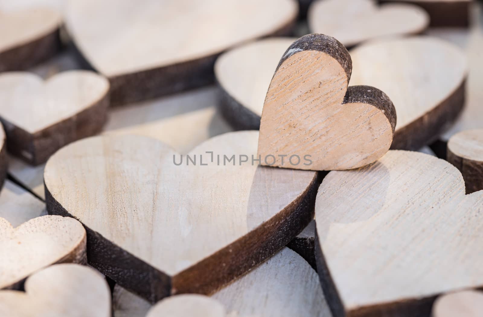 Valentine day background with many wooden love hearts