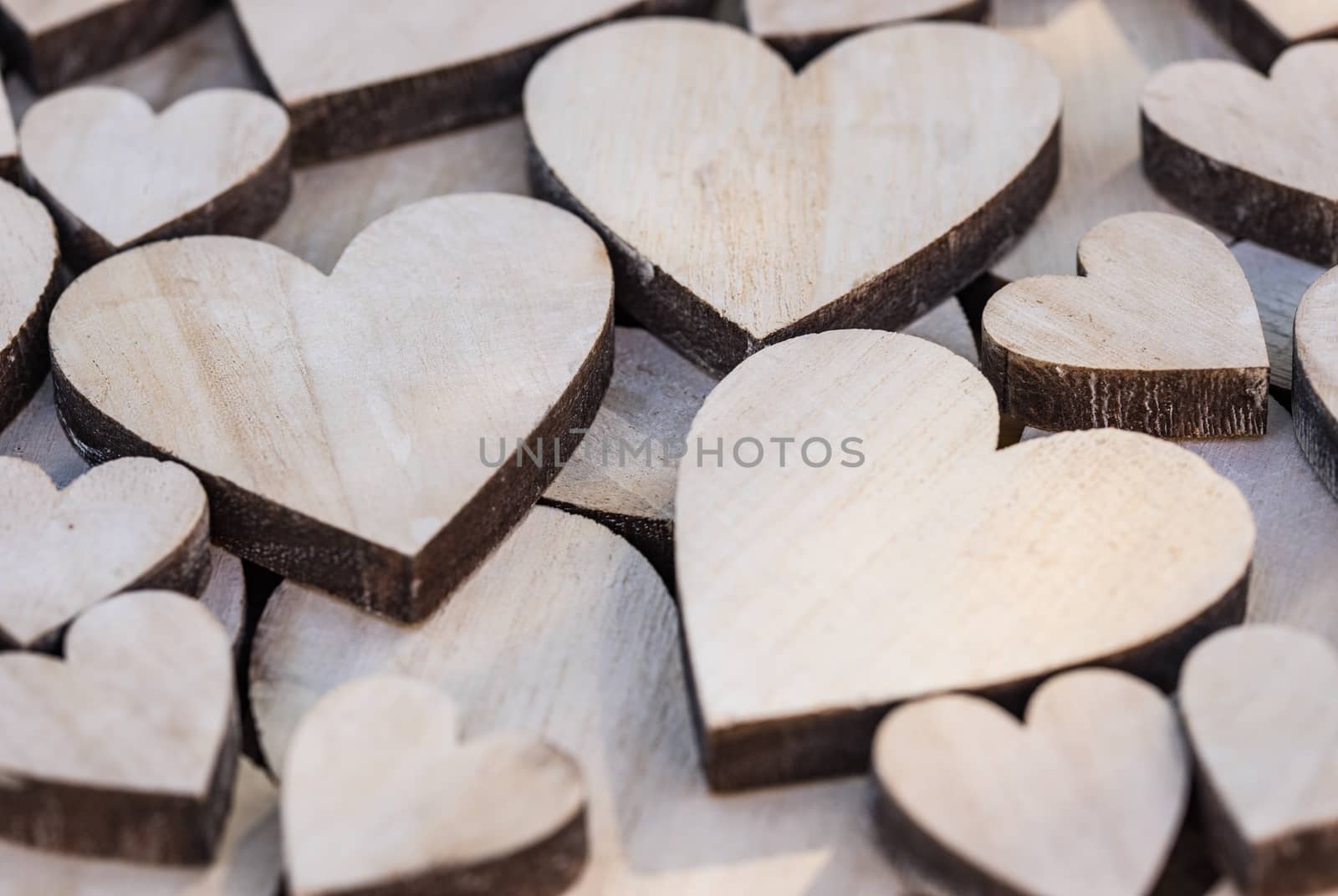 Valentine day background with many wooden love hearts