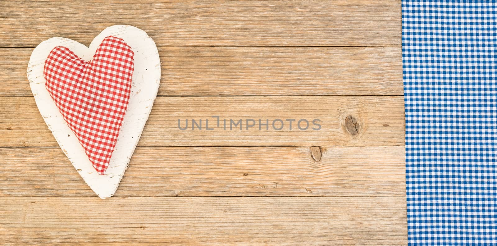 Rustic red heart on wooden background with copy space