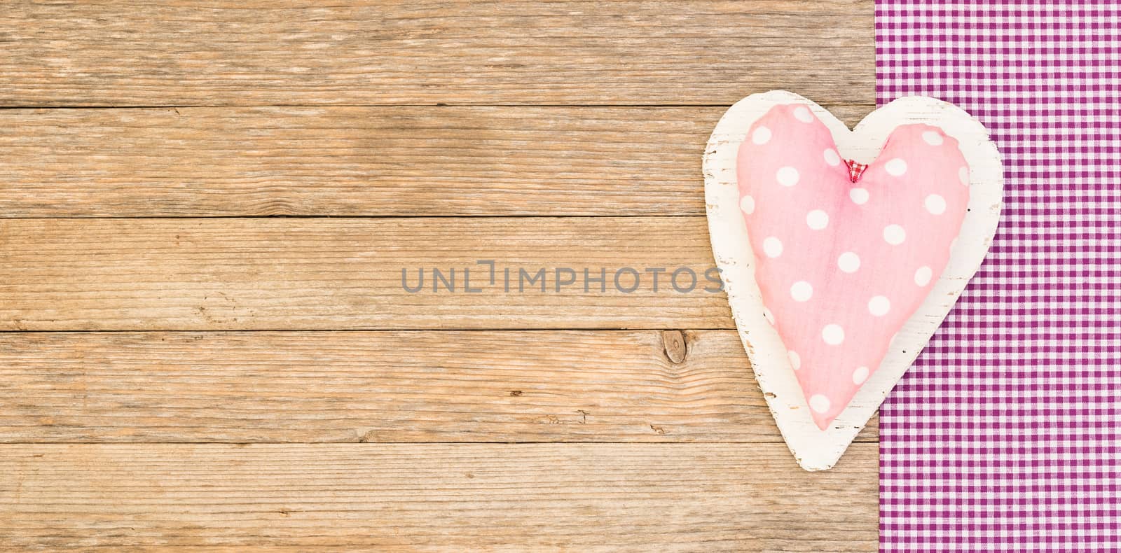 Romantic pink heart on wood background for Valentine card with copy space