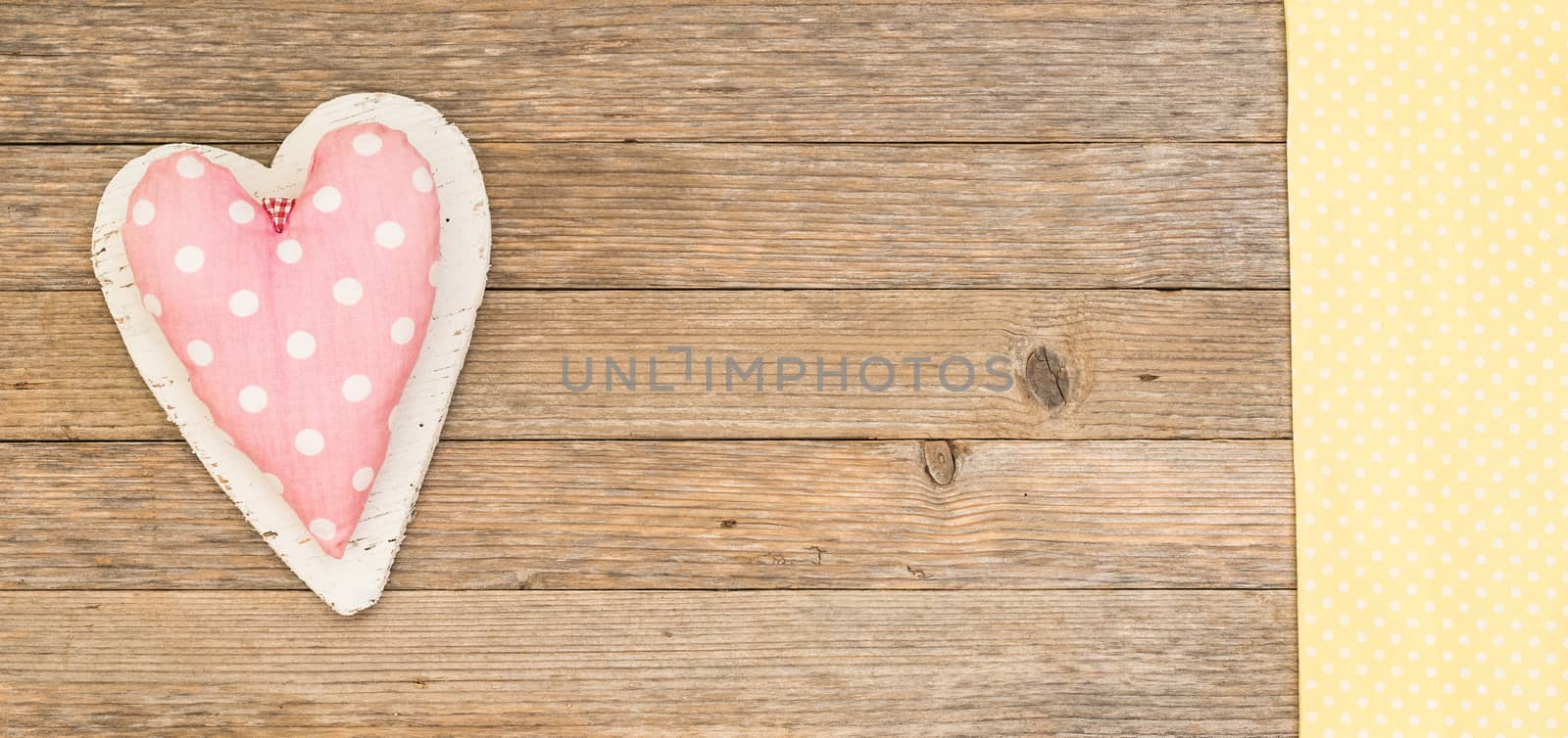 Romantic pink heart on wood background for Valentine card with copy space