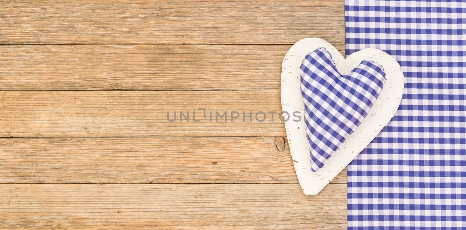 Rustic heart on wooden background with copy space