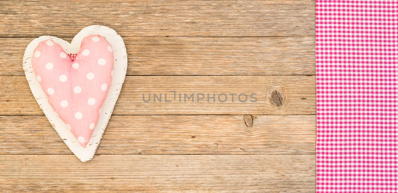 Romantic pink heart on wooden background for Valentine card with copy space