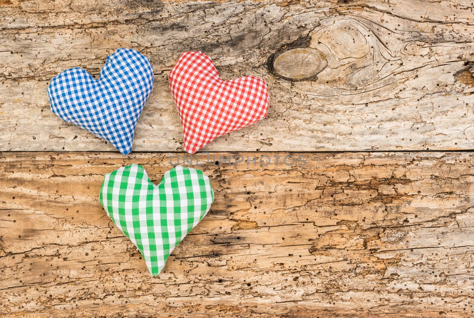 Hearts decoration on vintage wood background by Vulcano