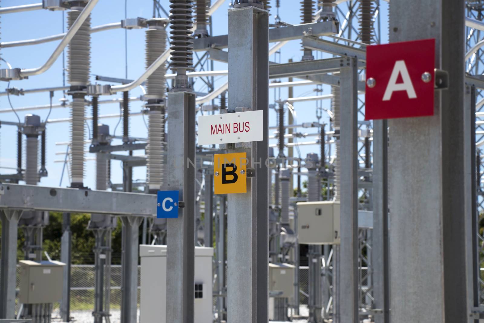 Sign showing main bus of a three-phase electrical system in the power substation.