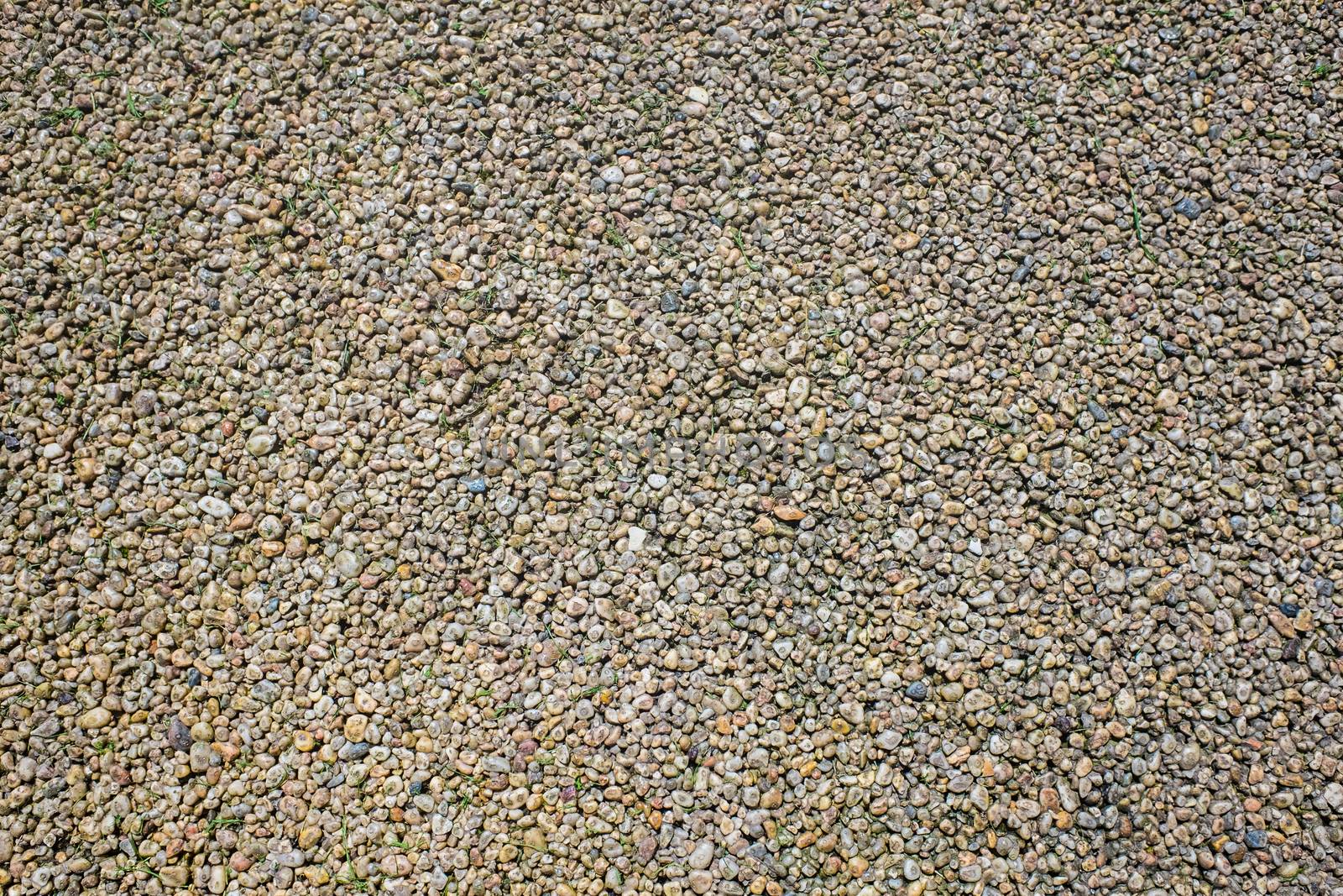 Closeup view of colored resin bound and bonded gravels laid for outdoor flooring. by paddythegolfer