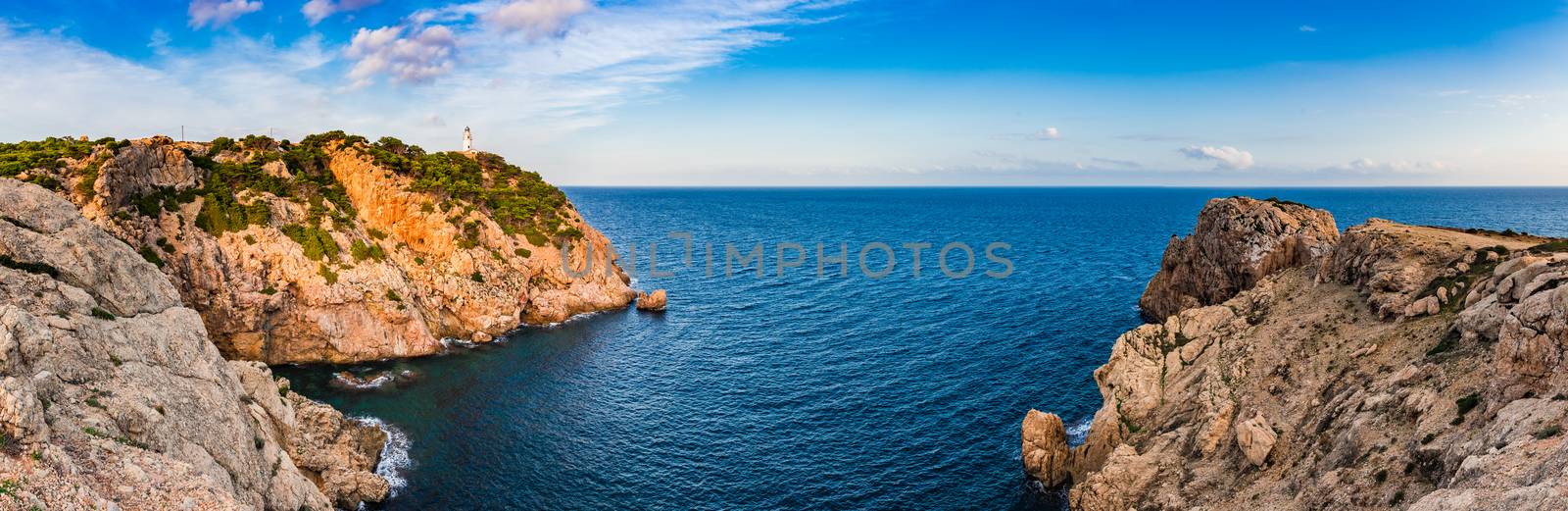 Lighthouse at the rocky coast on Mallorca island, Mediterranean Sea Spain, panorama view