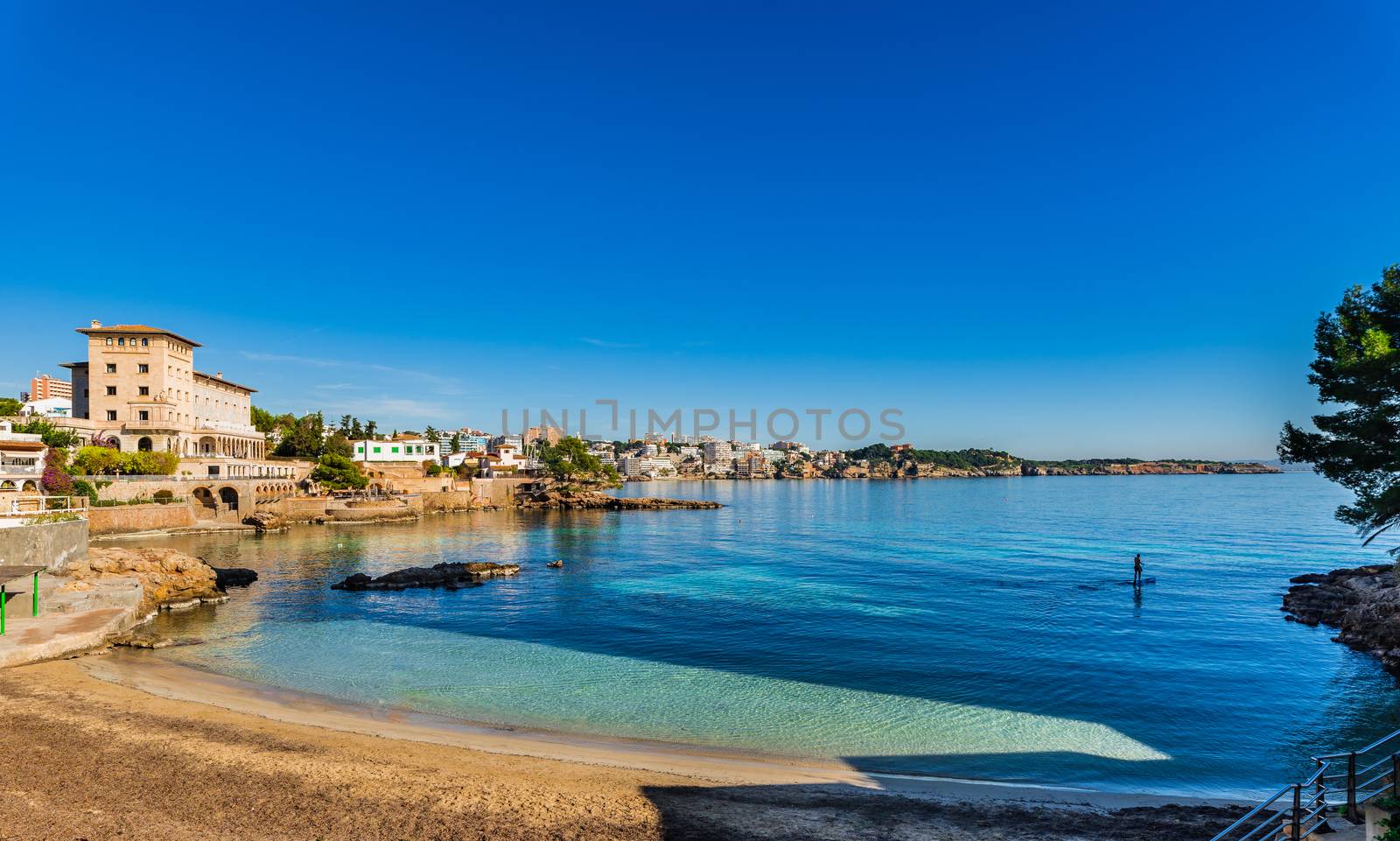 Idyllic view of beach Bougainvillea Caló dels Malls/Mais near Palma de Mallorca, Spain Mediterranean Sea