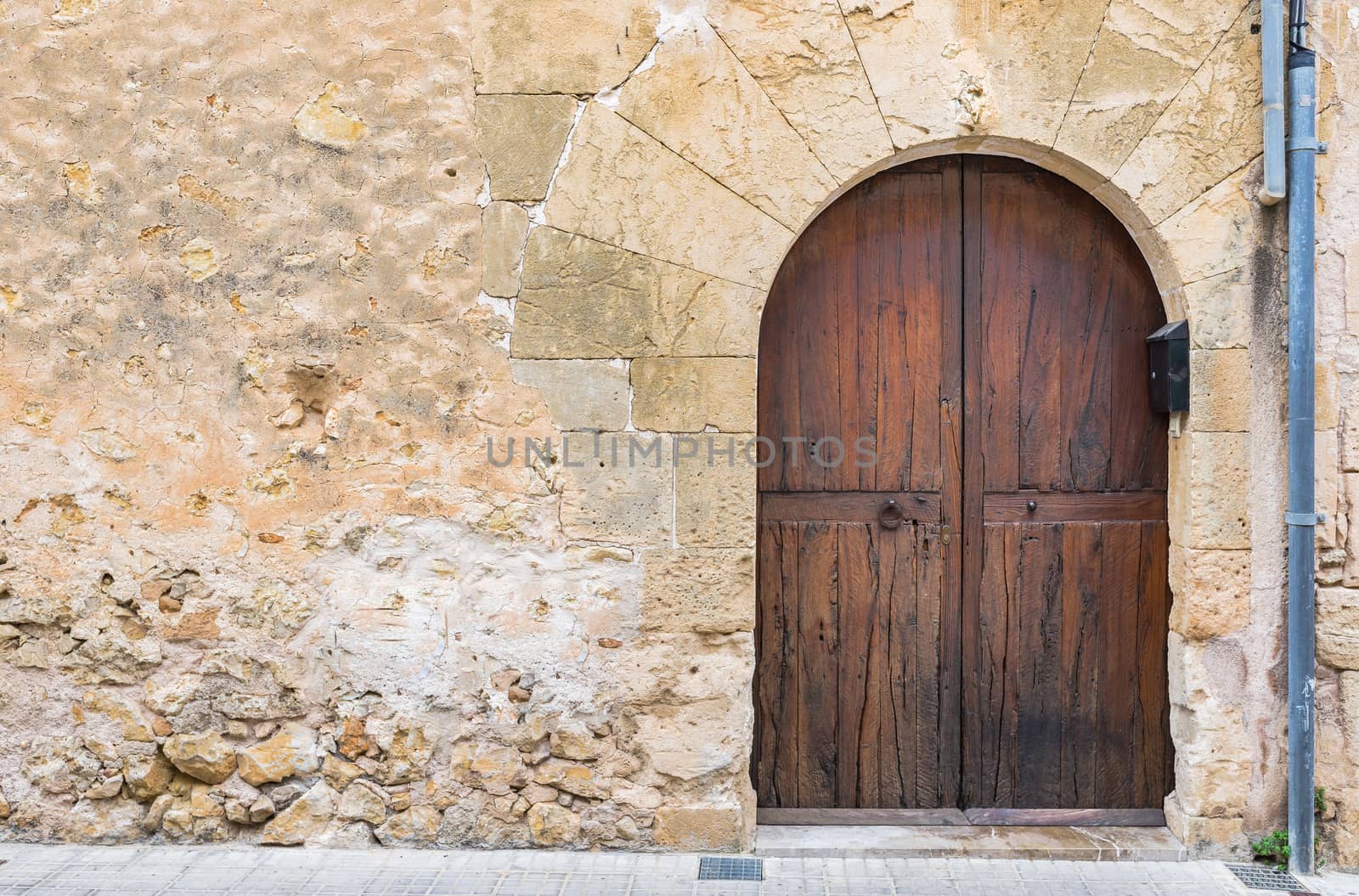 Old house wall and brown wood door background