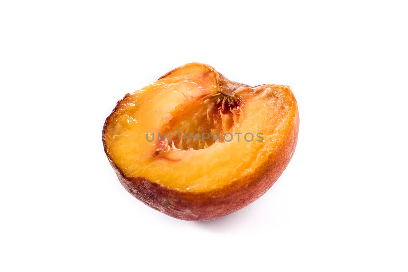 Piece of peach fruit isolated on white background