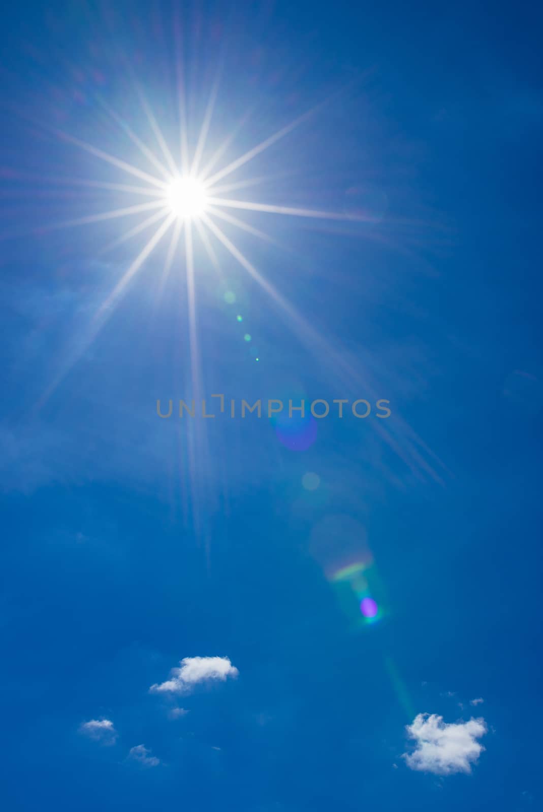 Beautiful sunrays on deep blue sky background